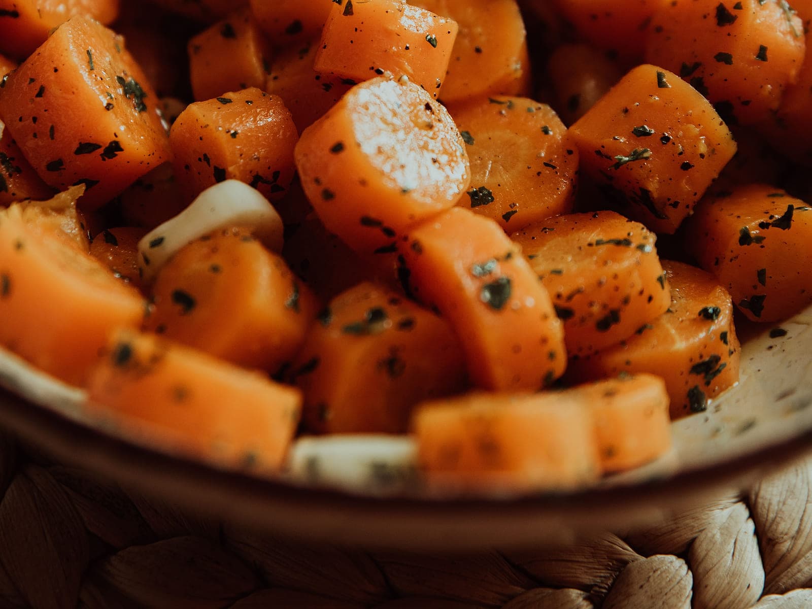 Moroccan carrot salad with cumin, parsley and lemon in a shallow dish