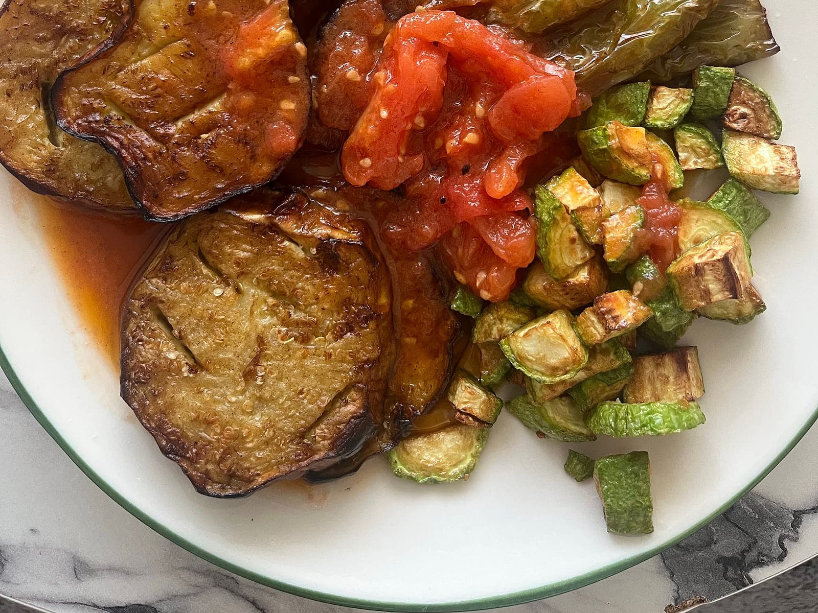 Moroccan taktouka salad of roasted green peppers and tomato in a shallow dish